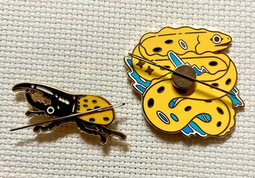 Hercules beetle and banana eel pin needleminders