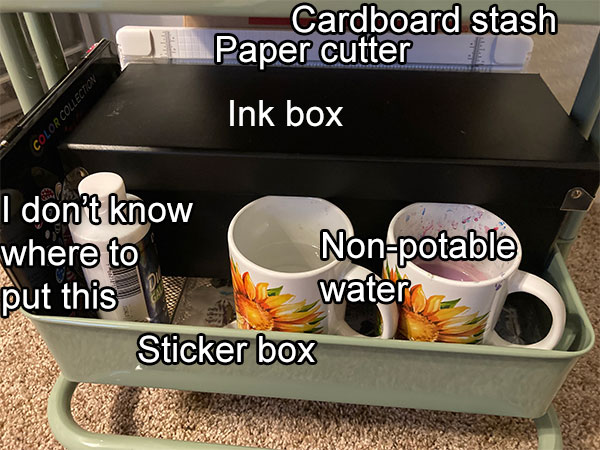 The bottom shelf of the cart