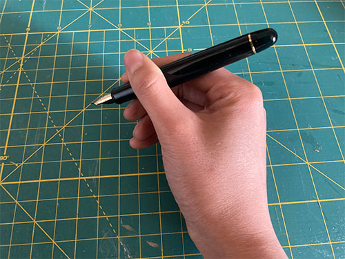 Holding the pen unposted