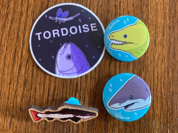 Shark and eel buttons and a catfish pin from Tordoise