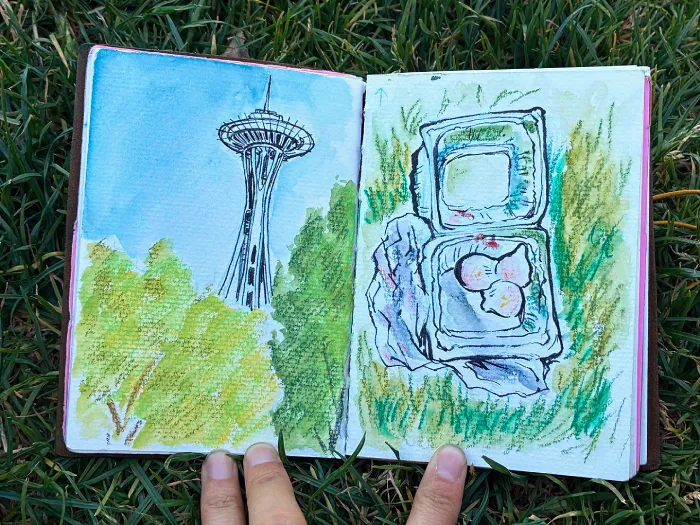 Spread of drawings of the Space Needle (left) and the dumplings I was eating (right)