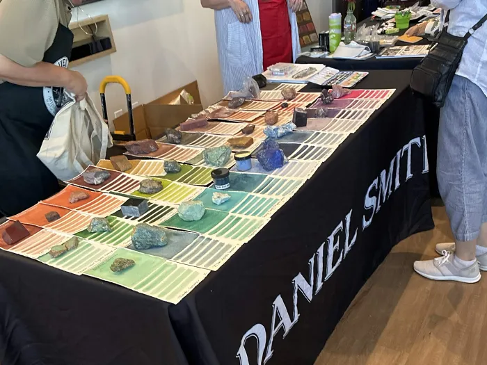 Photo of the Daniel Smith table with rocks all over it